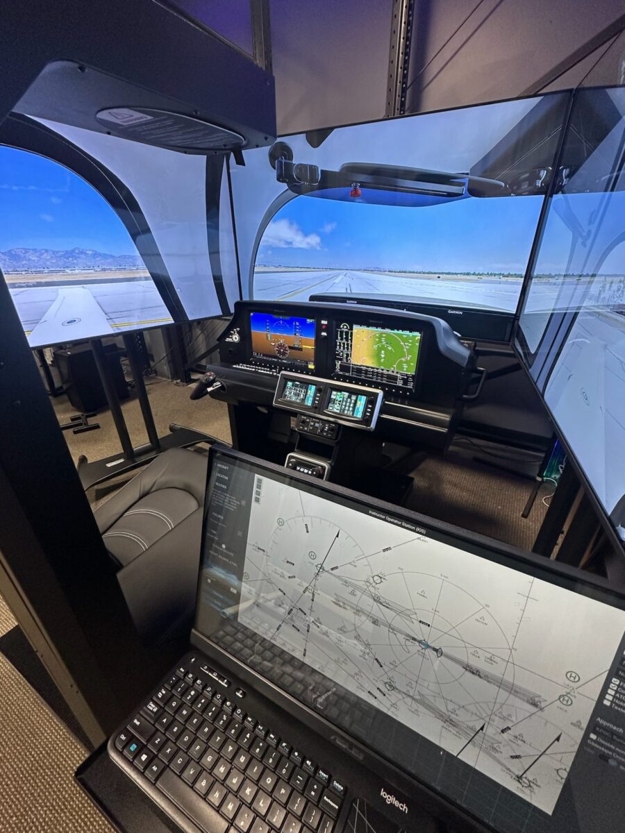Cirrus G7 flight simulator at Lipson Aviation showing the Garmin Perspective Touch+ panel and instructor operator station