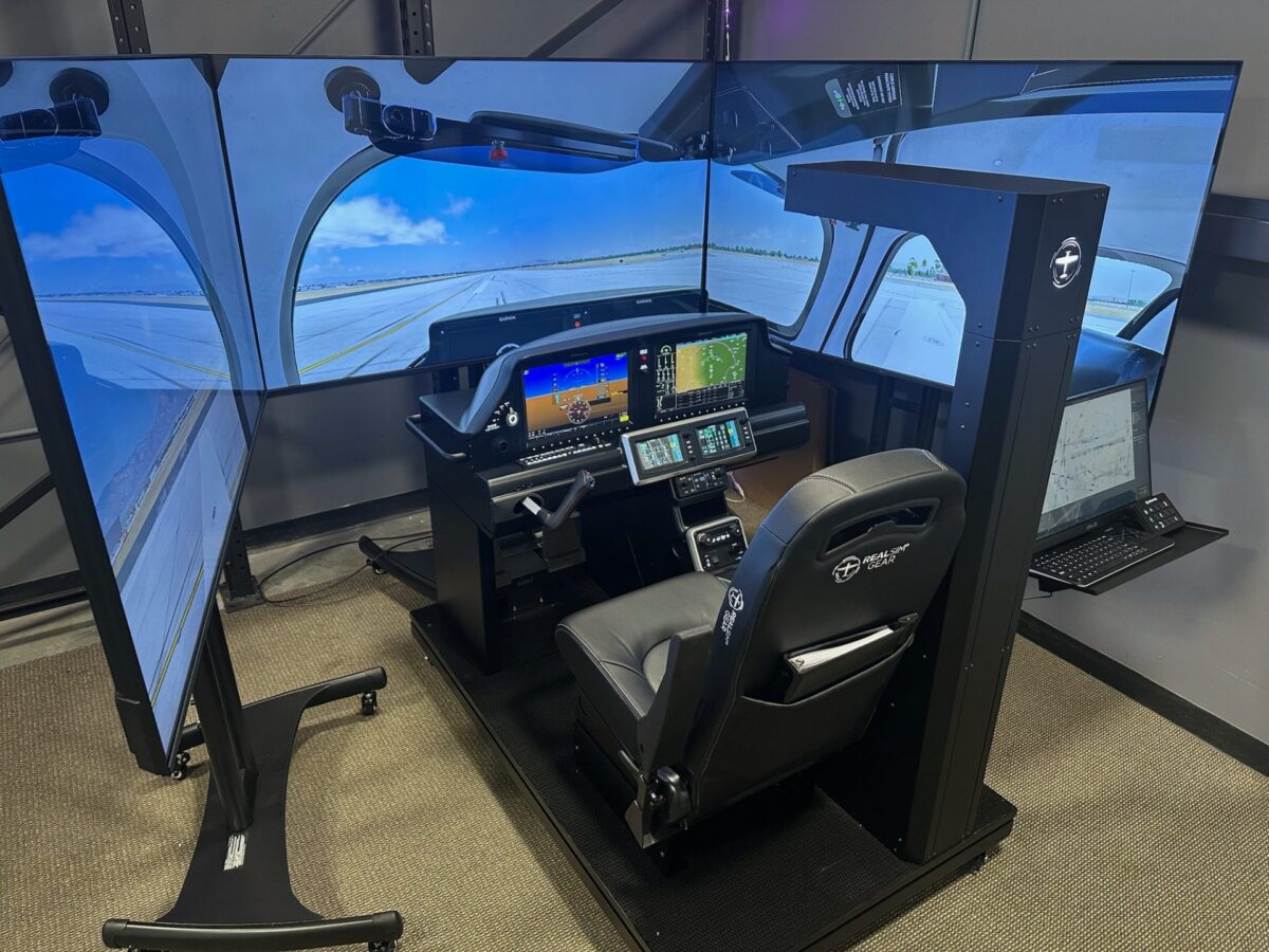 Full view of the Cirrus G7 RealSimGear flight simulator with wraparound visual displays at Lipson Aviation